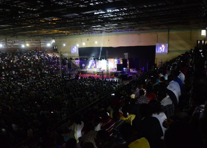 A packed arena, thousands in worship