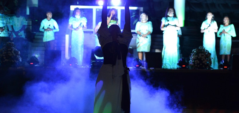A worship moment, caught in smoke and light
