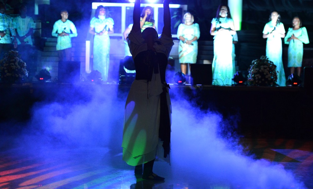 Dancer silhouetted in stage fog and lighting