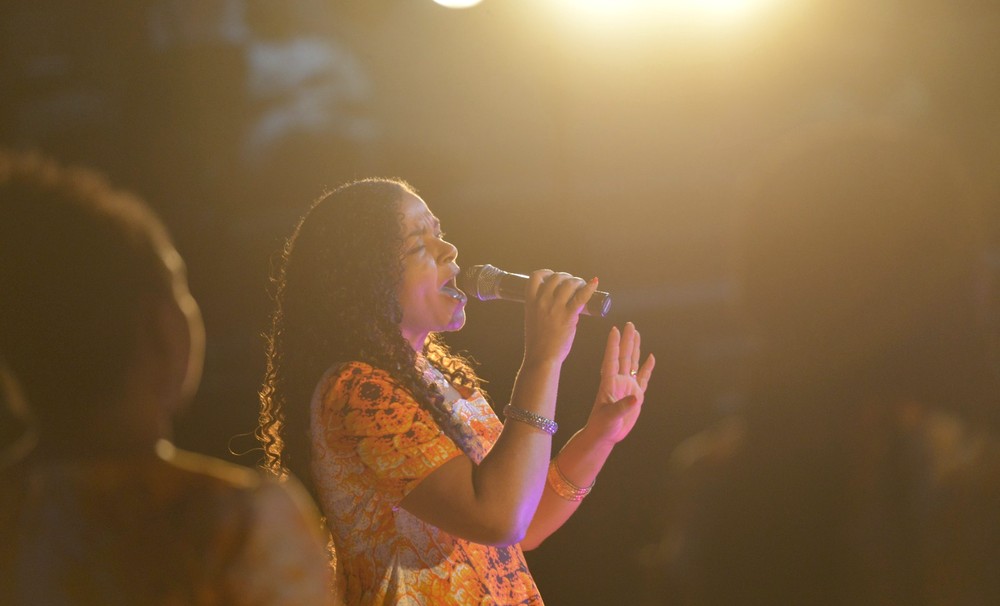 Olufunmi leading worship on stage